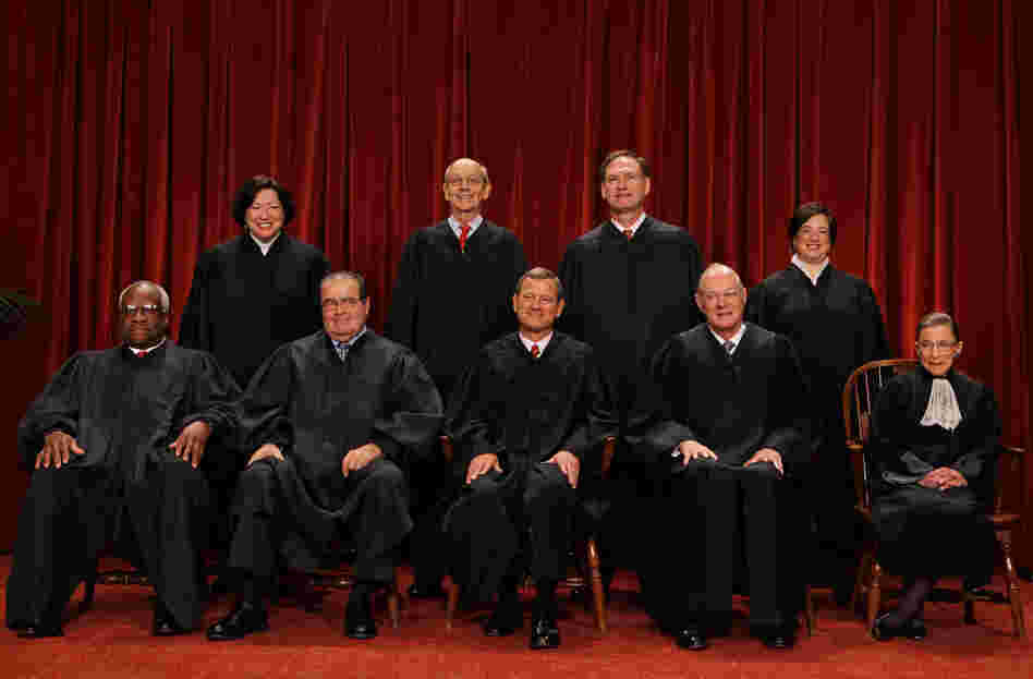 The U.S. Supreme Court justices (first row, from left) Clarence Thomas, Antonin Scalia, Chief Justice John Roberts, Anthony Kennedy, Ruth Bader Ginsburg, (back row) Sonia Sotomayor, Stephen Breyer, Samuel Alito and Elena Kagan.