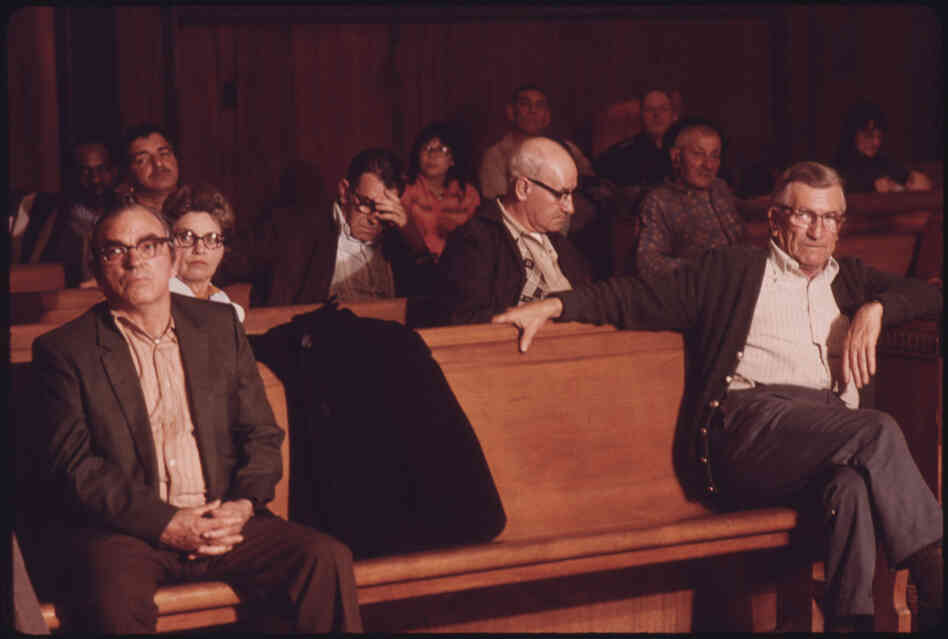 Men wait for the Beckley Black Lung Association meeting to begin. A fight for safer regulations dramatically decreased the hazards of mining.
