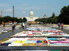Visitors view the AIDS Memorial Quilt at the National Mall. Visitors view the AIDS Memorial Quilt at the National Mall.