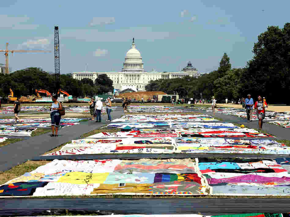 Visitors view the AIDS Memorial Quilt at the National Mall.