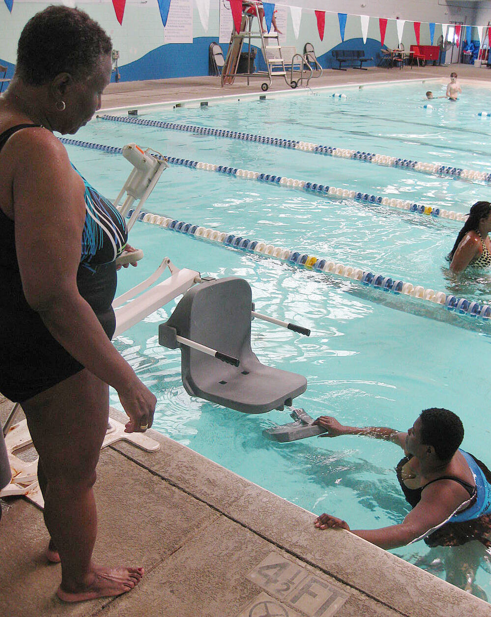 New government regulations require public pools to have chair lifts, like this one in Savannah, Ga., for people with disabilities. The compliance deadline has been extended for a second time.