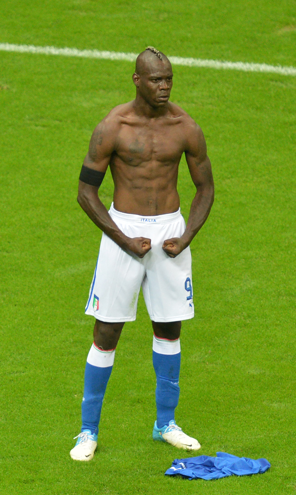 Italian forward Mario Balotelli celebrates after scoring the second goal during Italy's semifinal matchup with Germany in the Euro 2012 soccer championships in Warsaw, June 28. Italy went on to lose in the finals to Spain, but Balotelli has been hailed as a national hero, spurring debate over what constitutes Italian-ness.