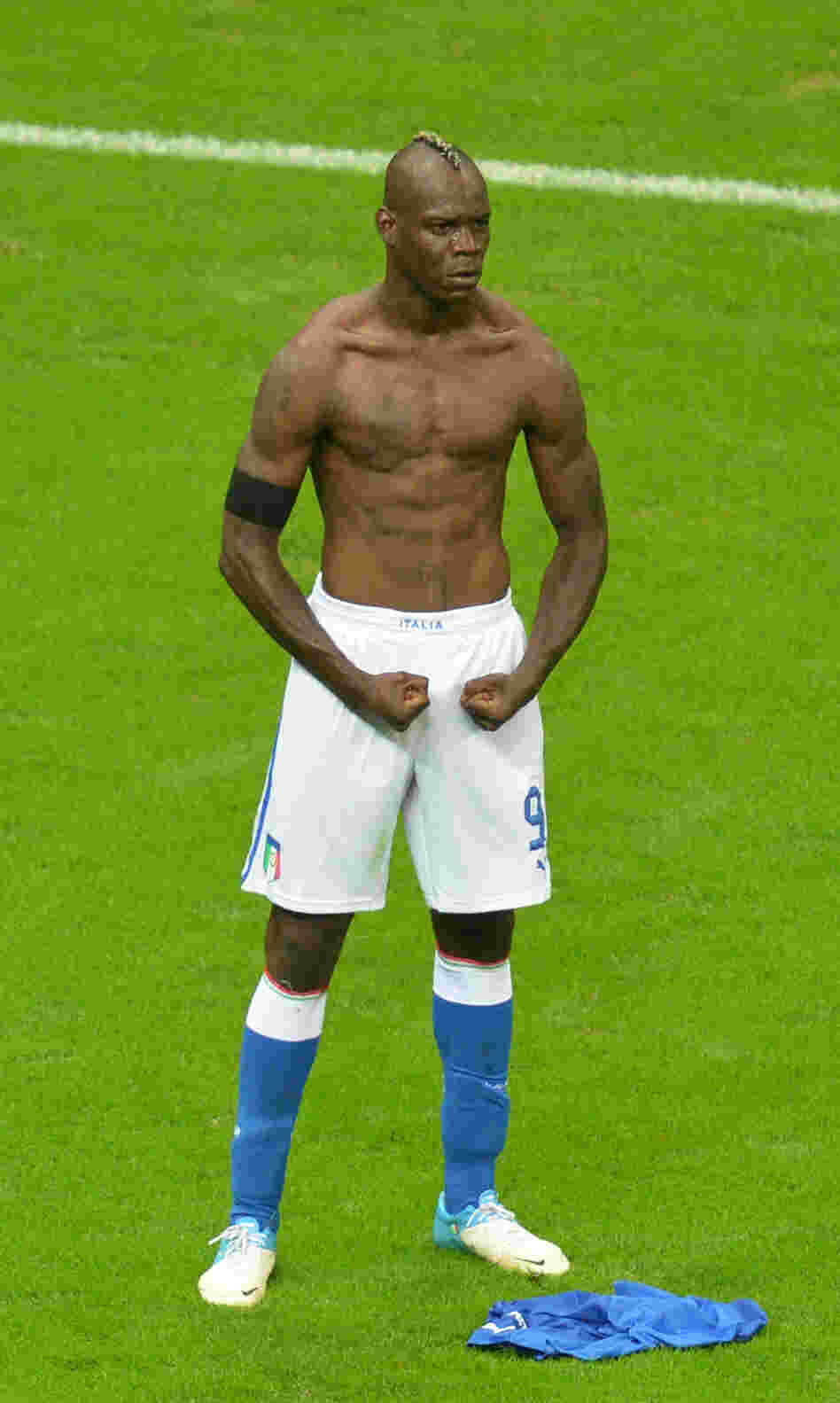 Italian forward Mario Balotelli celebrates after scoring the second goal during Italy's semifinal matchup with Germany in the Euro 2012 soccer championships in Warsaw, June 28. Italy went on to lose in the finals to Spain, but Balotelli has been hailed as a national hero, spurring debate over what constitutes Italian-ness.