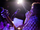 Ask Me Another's resident musician, the unstoppable Mr. Jonathan Coulton, pen in hand, works his improv magic on stage.