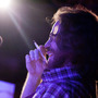 Ask Me Another's resident musician, the unstoppable Mr. Jonathan Coulton, pen in hand, works his improv magic on stage. Ask Me Another's resident musician, the unstoppable Mr. Jonathan Coulton, pen in hand, works his improv magic on stage.
