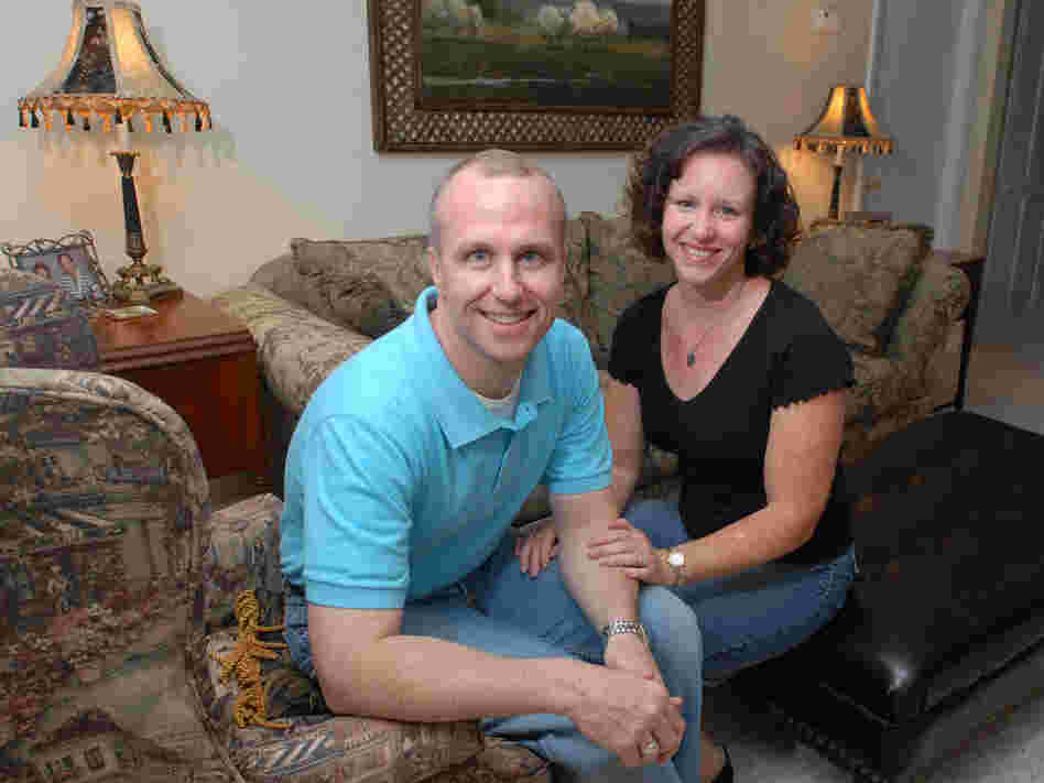 Alan Chambers, president of Exodus International, sits with his wife, Leslie, in their home in Winter Park, Fla., in 2006. Chambers recently announced his group will no longer associate with or promote therapy that focuses on changing sexual attraction.