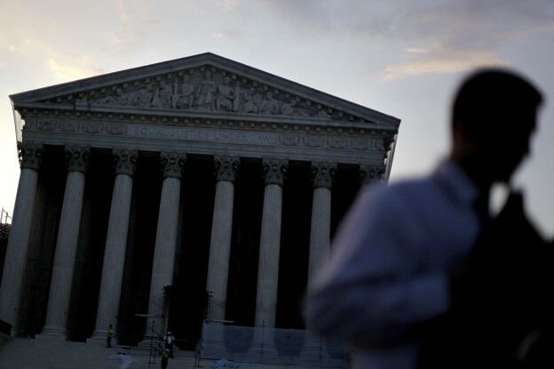 People gather outside the Supreme Court on June 28, the morning the health care ruling was announced. Lawyers say they're still teasing out the consequences for other key areas of the law — including civil rights.