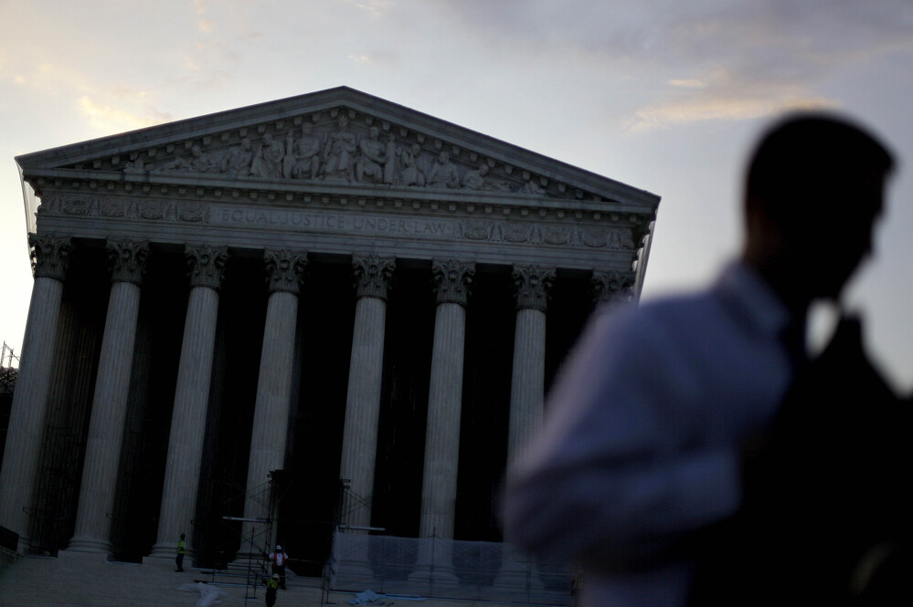 People gather outside the Supreme Court on June 28, the morning the health care ruling was announced. Lawyers say they're still teasing out the consequences for other key areas of the law — including civil rights.