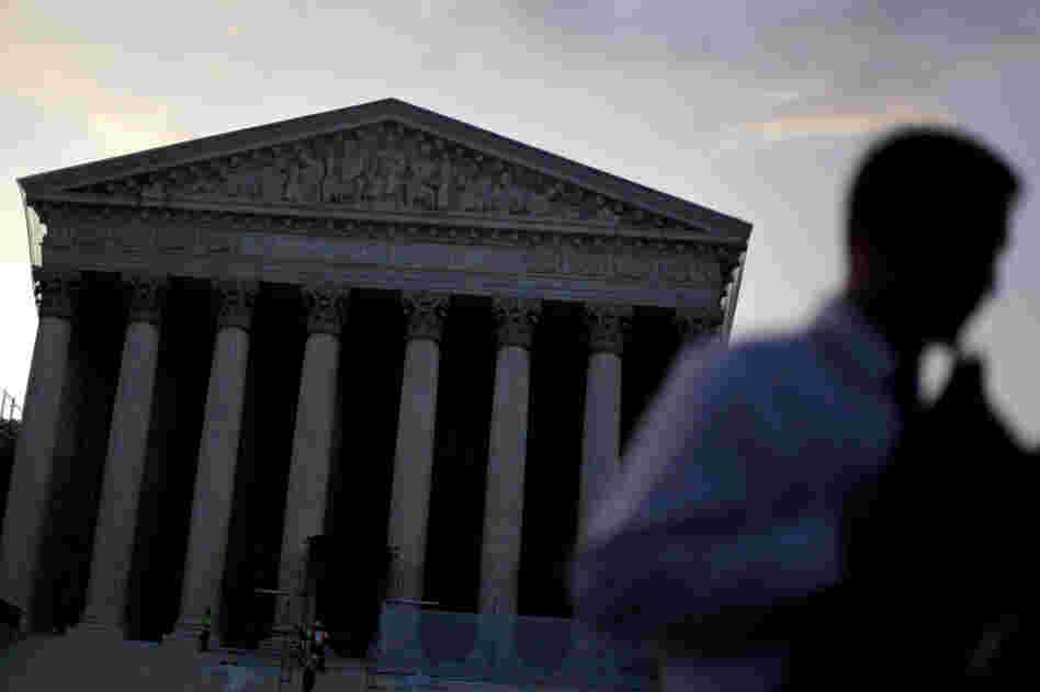 People gather outside the Supreme Court on June 28, the morning the health care ruling was announced. Lawyers say they're still teasing out the consequences for other key areas of the law — including civil rights.