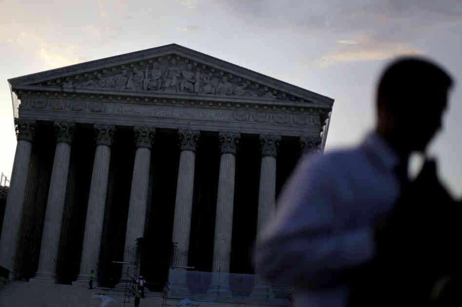 People gather outside the Supreme Court on June 28, the morning the health care ruling was announced. Lawyers say they're still teasing out the consequences for other key areas of the law — including civil rights.