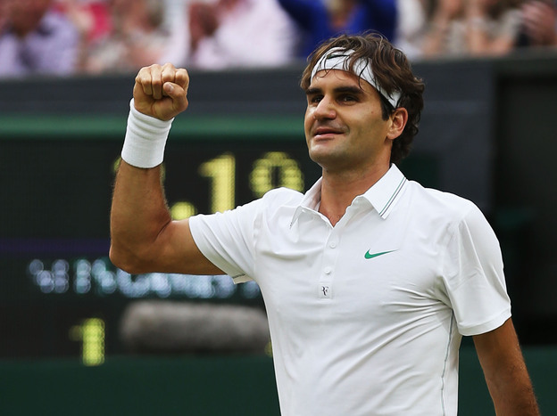 Roger Federer of Switzerland celebrates match point during his match today against Novak Djokovic of Serbia at the Wimbledon Lawn Tennis Championships.