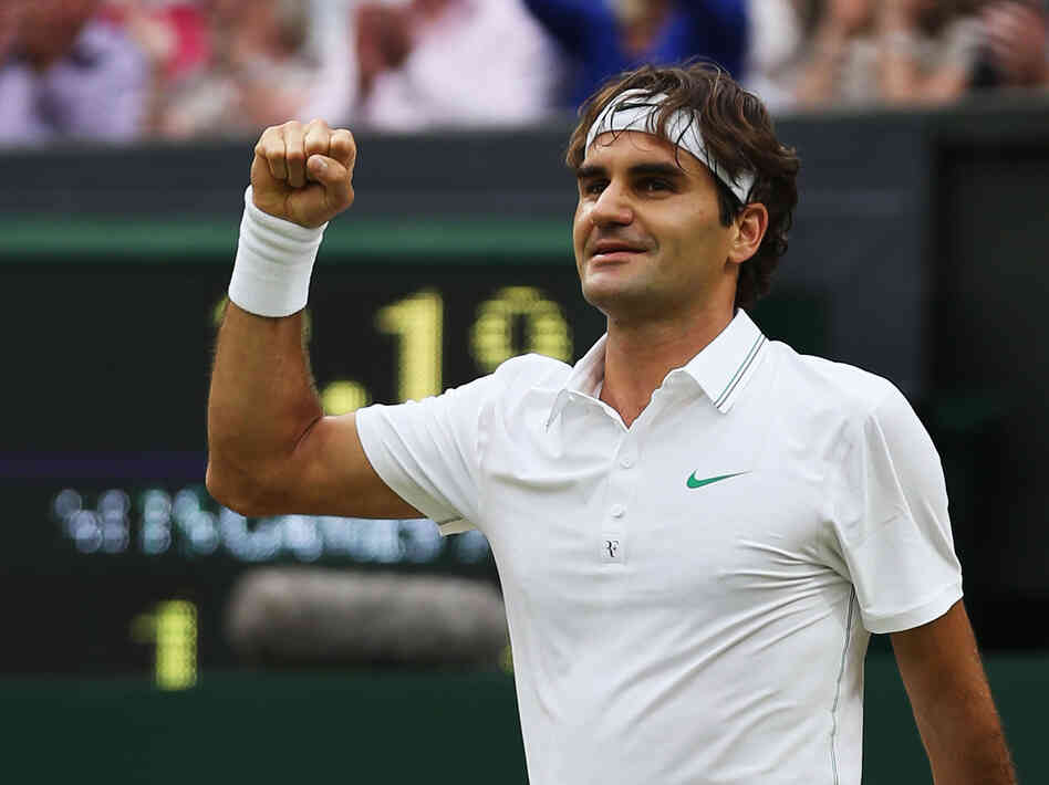 Roger Federer of Switzerland celebrates match point during his match today against Novak Djokovic of Serbia at the Wimbledon Lawn Tennis Championships.
