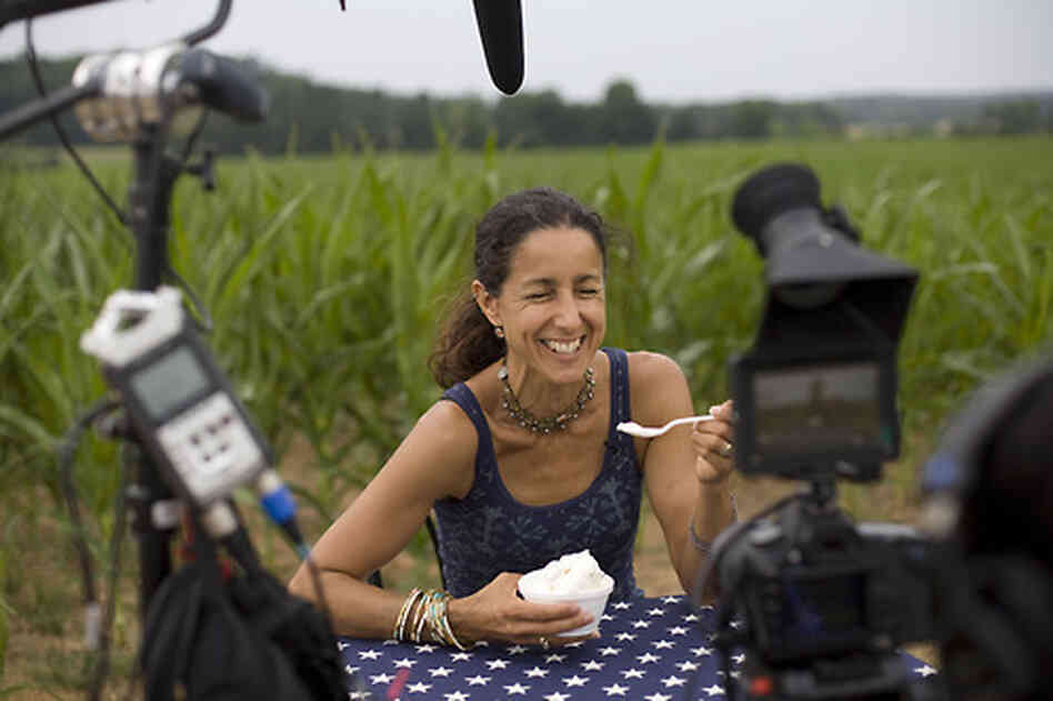 Filmmaker Julie Winokur sits at "The Table" at Maple View Farm in Hillsborough, N.C. She is traveling the country with a folding table and a star-spangled tablecloth, asking people to share their political beliefs. Filmmaker Julie Winokur sits at "The Table" at Maple View Farm in Hillsborough, N.C. She is traveling the country with a folding table and a star-spangled tablecloth, asking people to share their political beliefs.