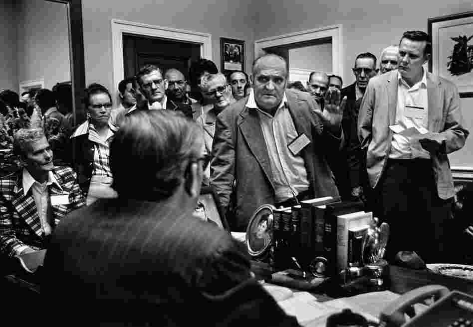Disabled coal miners and widows confront their Kentucky congressman's poor record of supporting black lung legislation in Washington, D.C., in 1975.