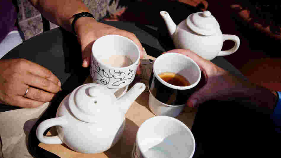 Palca and Morning Edition Executive Producer Madhulika Sikka test if hot tea can cool you down on a hot day. Palca and Morning Edition Executive Producer Madhulika Sikka test if hot tea can cool you down on a hot day.