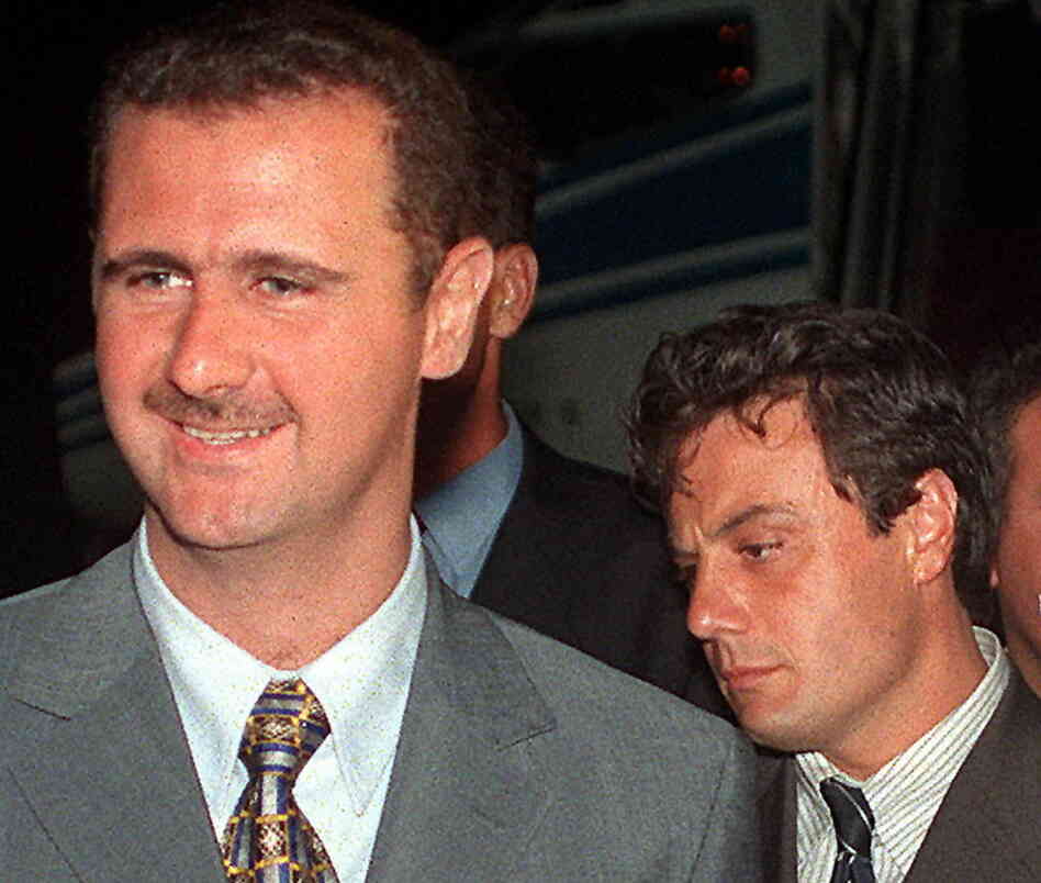 Then-Col. Bashar Assad (left) and Manaf Tlass in 1999. Tlass, now a brigadier general, has reportedly defected and is headed to France.