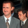 Then-Col. Bashar Assad (left) and Manaf Tlass in 1999. Tlass, now a brigadier general, has reportedly defected and is headed to France.