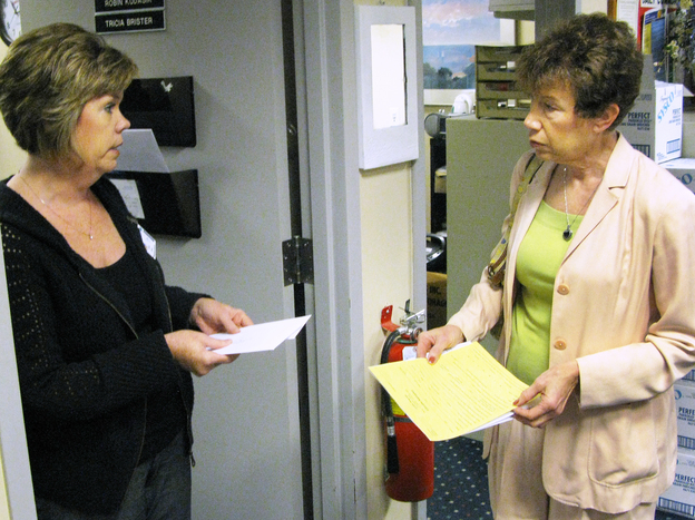 Deborah Klein (right) meets with Tricia Brister, volunteer coordinator at Griffin Hospital in Derby, Conn., about volunteer opportunities.