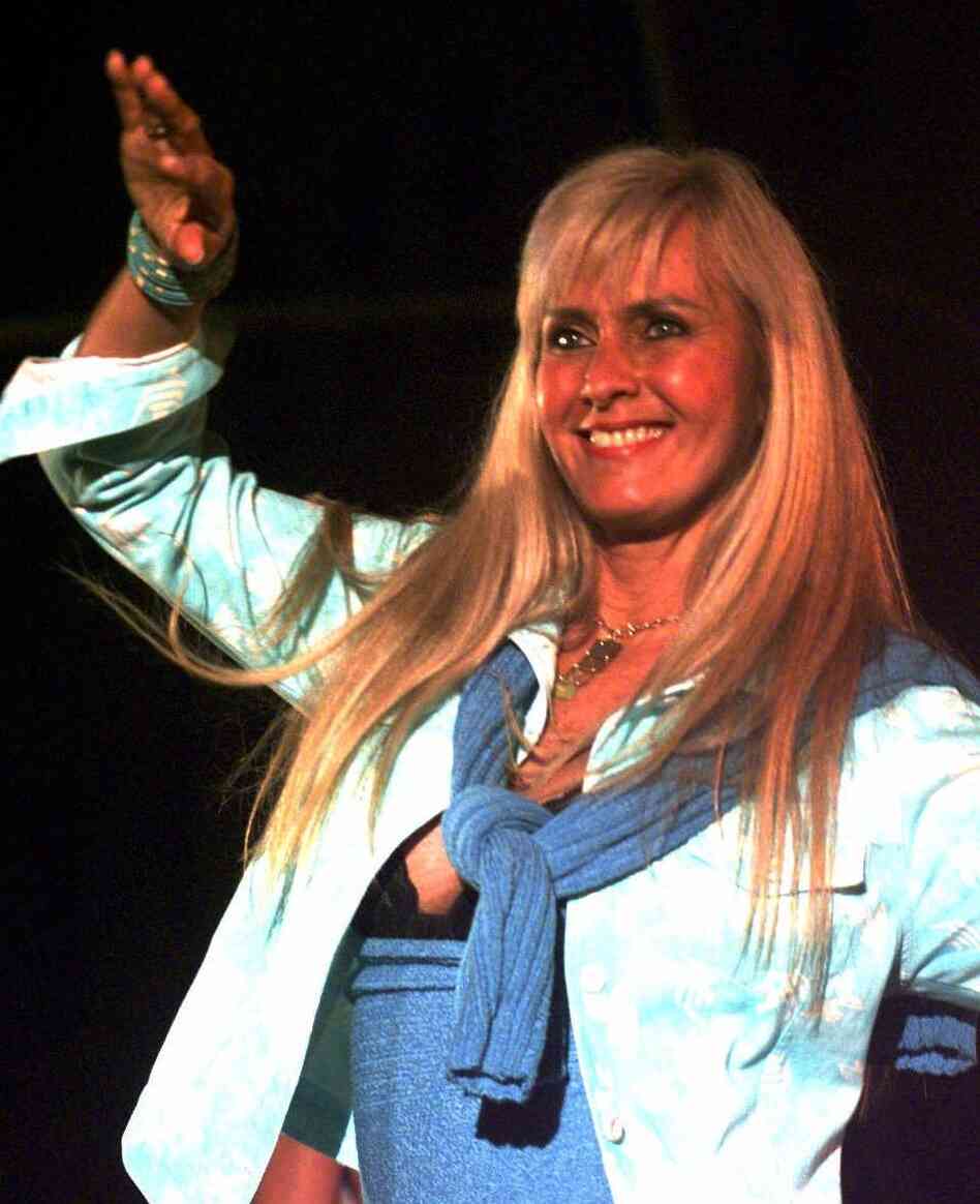 Helo Pinheiro, who inspired the song "The Girl From Ipanema," dances during a fashion show in Rio de Janeiro in 1999.