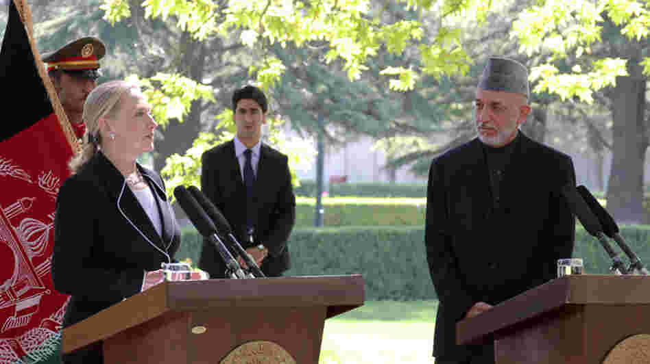 In Kabul, Secretary of State Hillary Clinton announces that Afghanistan is now a "major non-NATO ally" alongside Afghan President Hamid Karzai.