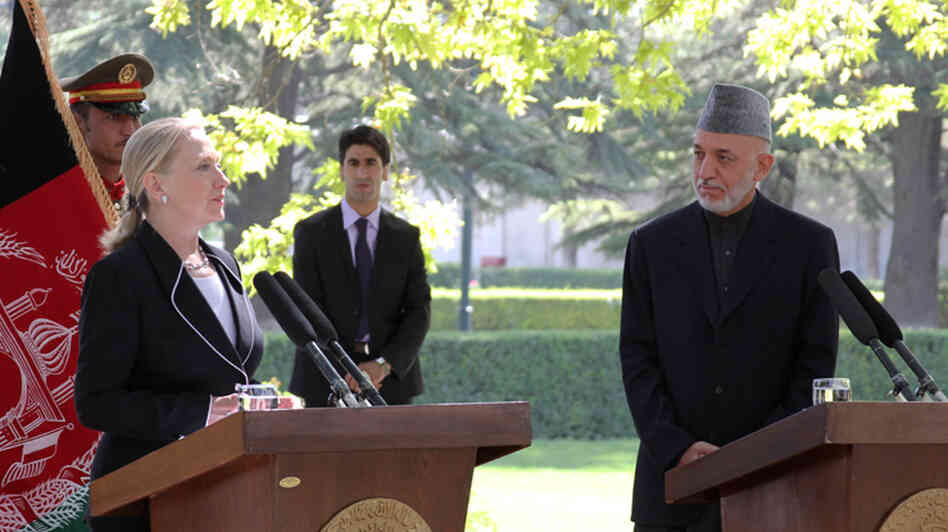 In Kabul, Secretary of State Hillary Clinton announces that Afghanistan is now a "major non-NATO ally" alongside Afghan President Hamid Karzai.