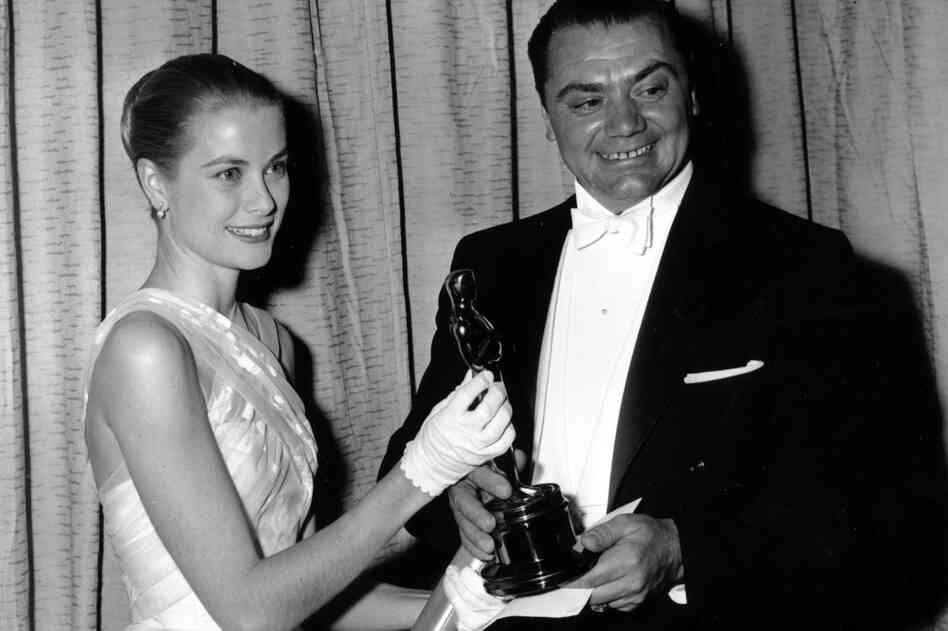 Borgnine, seen here with Grace Kelly, won an Oscar for his role in the movie Marty.