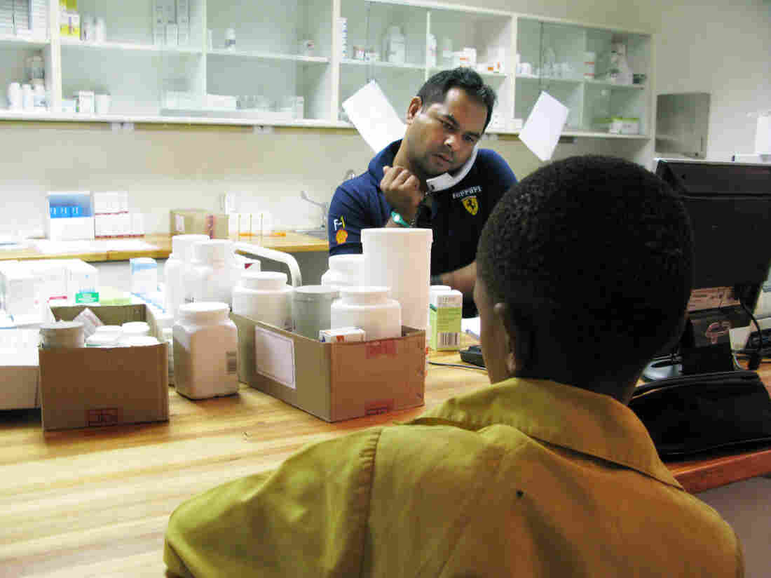 A boy waits to get his anti-AIDS drugs from pharmacist Rajesh Chandra at the Botswana-Baylor Children's Clinical Center of Excellence in Gaborone. A boy waits to get his anti-AIDS drugs from pharmacist Rajesh Chandra at the Botswana-Baylor Children's Clinical Center of Excellence in Gaborone.