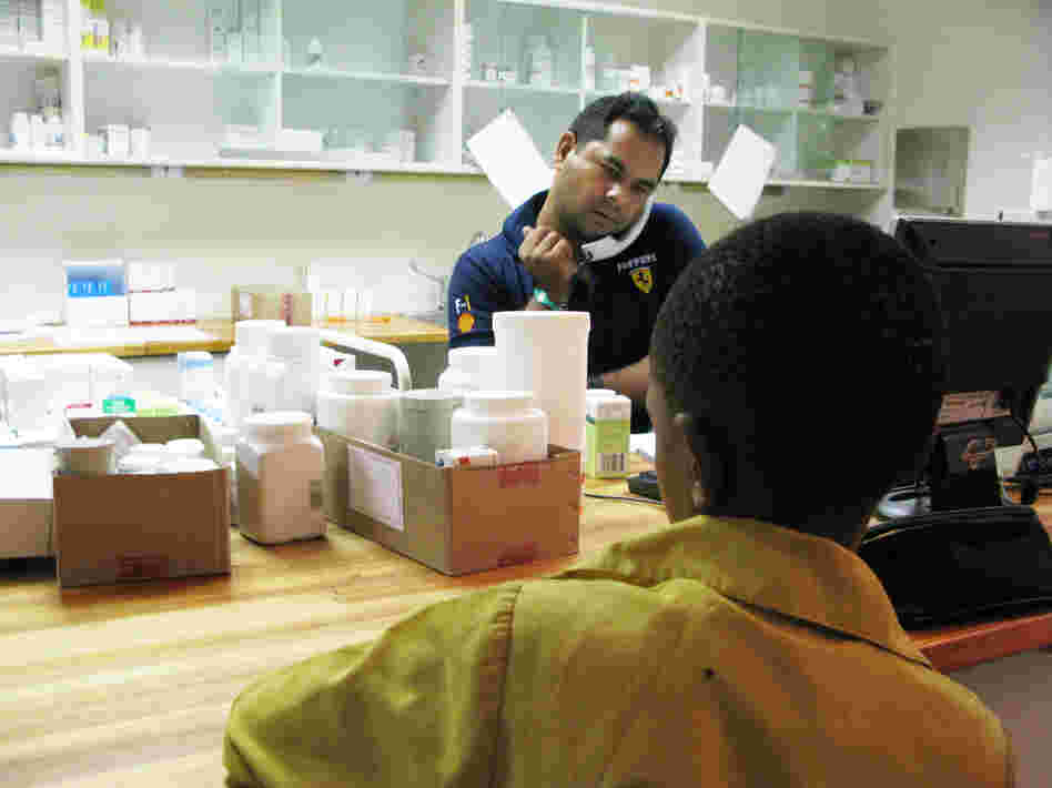 A boy waits to get his anti-AIDS drugs from pharmacist Rajesh Chandra at the Botswana-Baylor Children's Clinical Center of Excellence in Gaborone. A boy waits to get his anti-AIDS drugs from pharmacist Rajesh Chandra at the Botswana-Baylor Children's Clinical Center of Excellence in Gaborone.