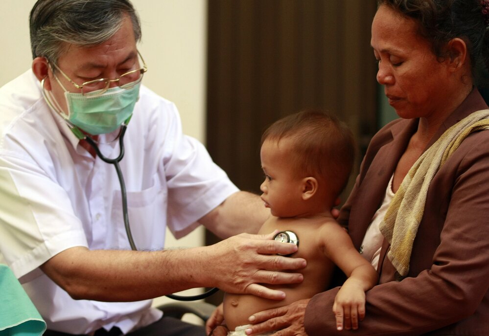 A Cambodian doctor examines a child at Kantha Bopha Children's Hospital in Phnom Penh.
