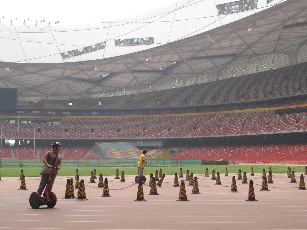 One money-making scheme has been to lease out Segways to tourists: $20 for a 15-minute ride around the Olympic track at the Bird's Nest.