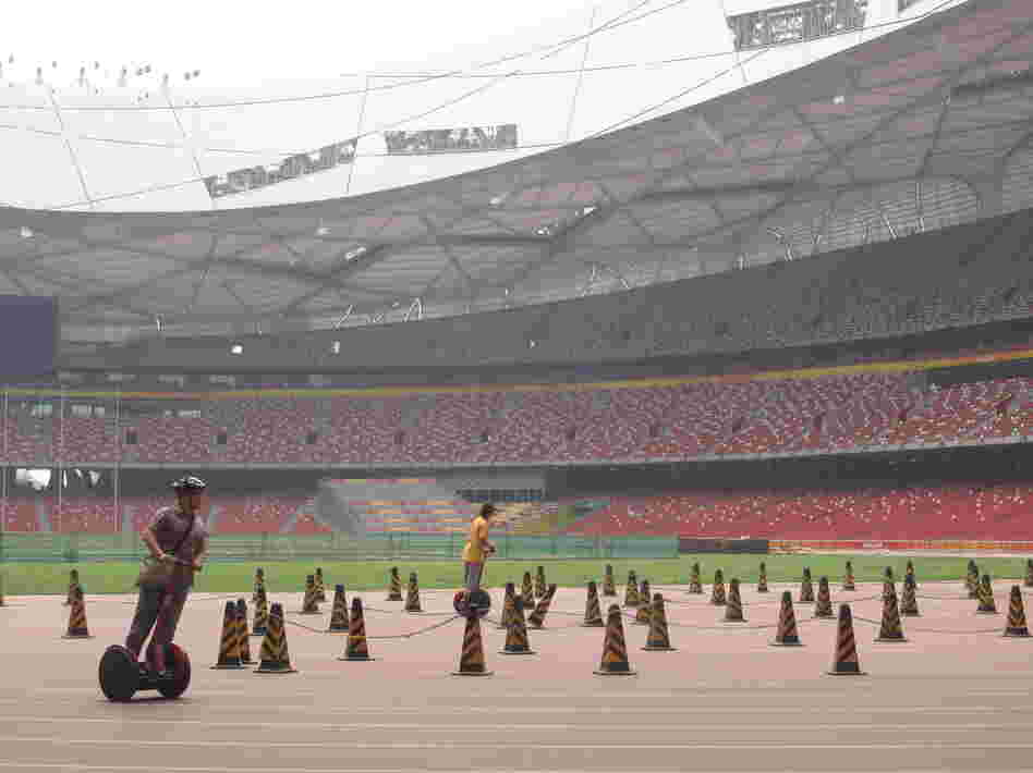 One money-making scheme has been to lease out Segways to tourists: $20 for a 15-minute ride around the Olympic track at the Bird's Nest.