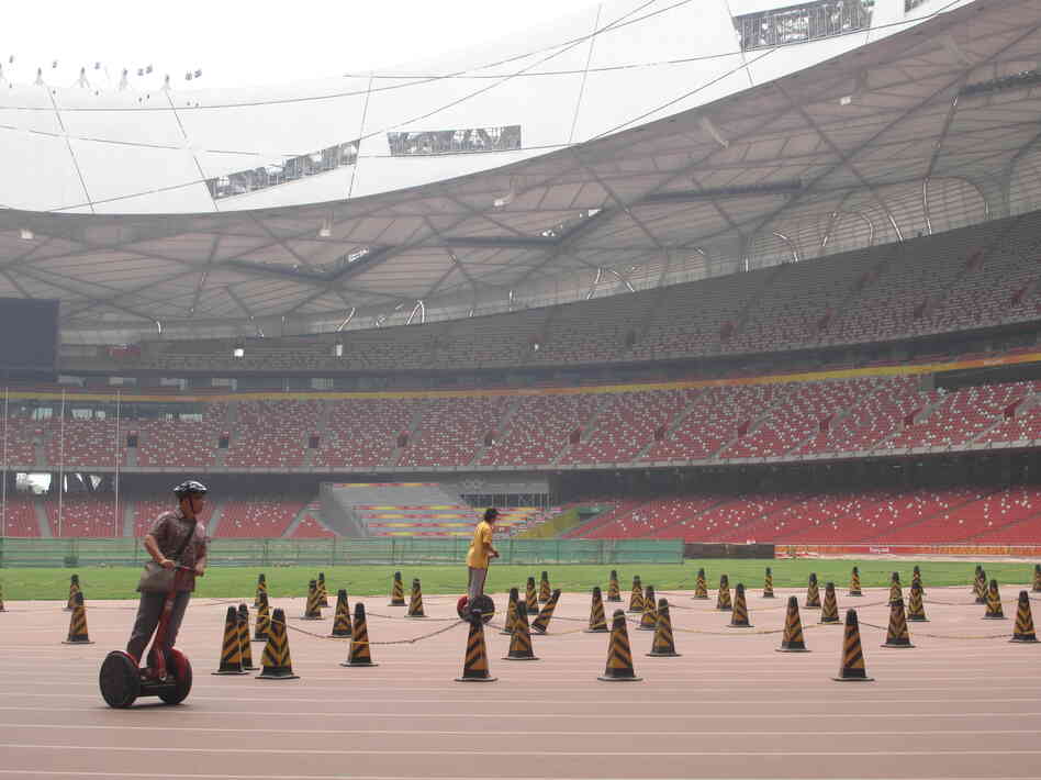 One money-making scheme has been to lease out Segways to tourists: $20 for a 15-minute ride around the Olympic track at the Bird's Nest.