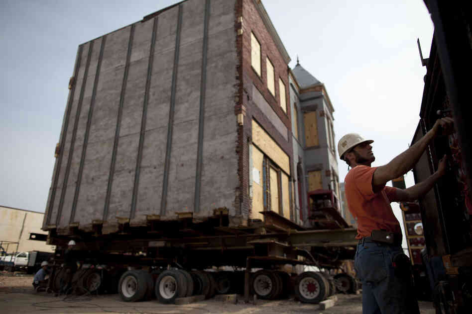 Once the buildings are lifted, they are moved by remote control.