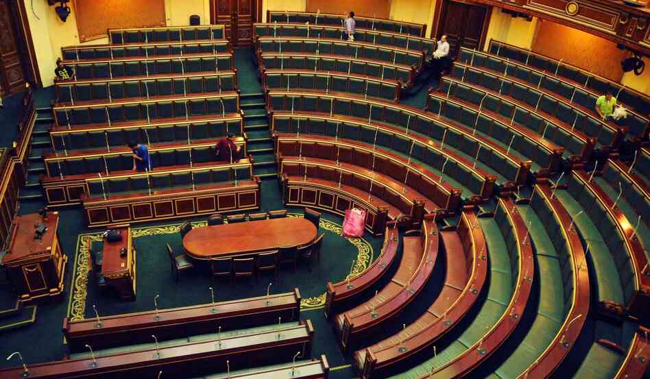 Workers clean inside the Egyptian parliament in Cairo on Monday.