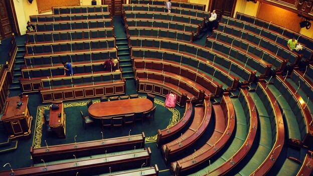 Workers clean inside the Egyptian parliament in Cairo on Monday. (AP)