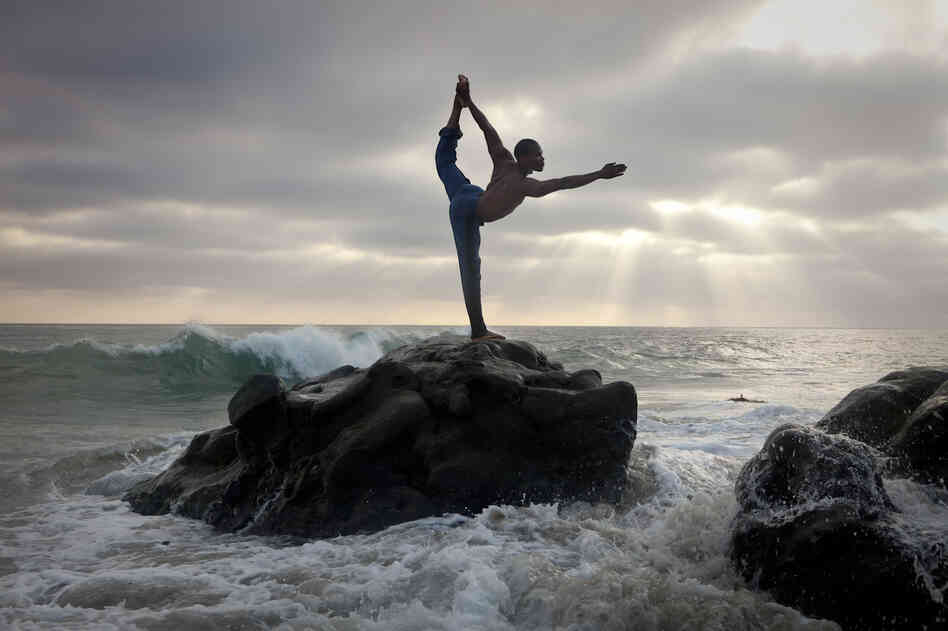 Newton Campbell, originally from Jamaica, quit his high-paying job as a corporate comptroller and began to teach yoga and live a more simple life. He now owns his own studio outside of Los Angeles.