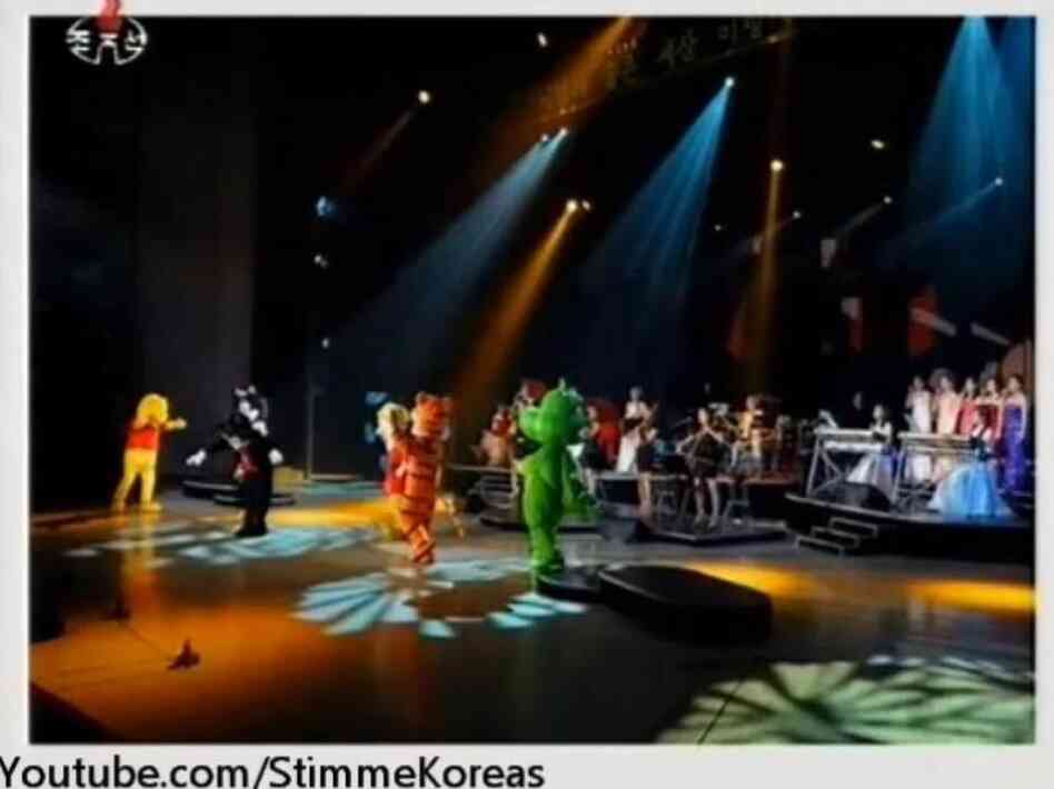 An image from a video posted by StimmeKoreas, which in turn came from North Korea official media, showing some of the dancing (fake) Disney characters at Friday's performance.