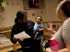 Devora Trapp, 24, picks up her 8-month-old son, Dardarius Taylor, late one evening at the Opportunity House's Second Street Learning Center, a 24-hour day care center for low-income families in Reading, Pa. Devora Trapp, 24, picks up her 8-month-old son, Dardarius Taylor, late one evening at the Opportunity House's Second Street Learning Center, a 24-hour day care center for low-income families in Reading, Pa.