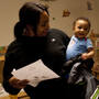 Devora Trapp, 24, picks up her 8-month-old son, Dardarius Taylor, late one evening at the Opportunity House's Second Street Learning Center, a 24-hour day care center for low-income families in Reading, Pa.