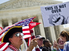 Susan Clark (left) argues with another protester about the Affordable Care Act outside the U.S. Supreme Court. Chief Justice John Roberts likened the law's Medicaid expansion provision to "a gun to the head" of states. Susan Clark (left) argues with another protester about the Affordable Care Act outside the U.S. Supreme Court. Chief Justice John Roberts likened the law's Medicaid expansion provision to "a gun to the head" of states.