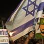 Israeli reservists soldiers and Israeli parents whose children were killed during army service attend a rally in support of a new law to mandate universal military conscription — including ultra-religious Jews who had been previously exempt and Arab Israelis, July 7, in Tel Aviv, Israel.