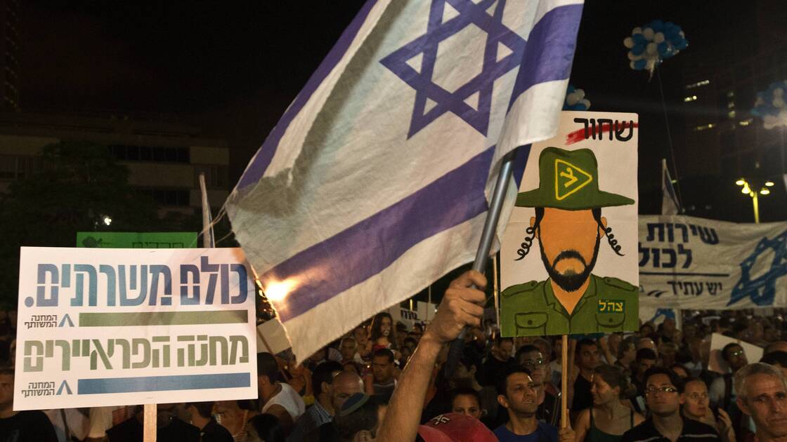 Israeli reservists soldiers and Israeli parents whose children were killed during army service attend a rally in support of a new law to mandate universal military conscription — including ultra-religious Jews who had been previously exempt and Arab Israelis, July 7, in Tel Aviv, Israel.