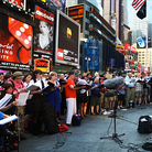 Conductor Kent Tritle leads an impromptu choir in the world premiere of Philip Glass' "A New Rule" in New York's Times Square. Conductor Kent Tritle leads an impromptu choir in the world premiere of Philip Glass' "A New Rule" in New York's Times Square.