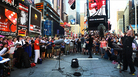 Conductor Kent Tritle leads an impromptu choir in the world premiere of Philip Glass' "A New Rule" in New York's Times Square. Conductor Kent Tritle leads an impromptu choir in the world premiere of Philip Glass' "A New Rule" in New York's Times Square.