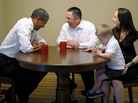 President Obama meets with Jason and Ali McLaughlin and their son, Cooper, while visiting their home in Cedar Rapids, Iowa. President Obama meets with Jason and Ali McLaughlin and their son, Cooper, while visiting their home in Cedar Rapids, Iowa.