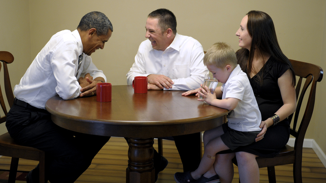 President Obama meets with Jason and Ali McLaughlin and their son, Cooper, while visiting their home in Cedar Rapids, Iowa.
