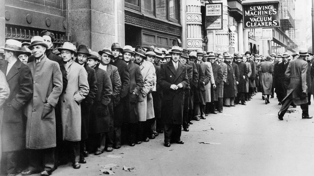 Thousands of unemployed people wait outside the State Labor Bureau in New York City to register for federal relief jobs in 1933.
