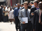 Applicants wait to enter a job fair in New York City last month. Applicants wait to enter a job fair in New York City last month.