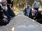 In February, these Syrians mourned over the fresh grave of a relative following a funeral for victims killed in violence in Idlib. In February, these Syrians mourned over the fresh grave of a relative following a funeral for victims killed in violence in Idlib.