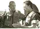 David Crist's father, George (left), discusses operations against Iranian attack boats with Navy Lt. Paul Hillenbrand. George Crist, a Marine Corps general, was commander of CENTCOM from 1985-1988.